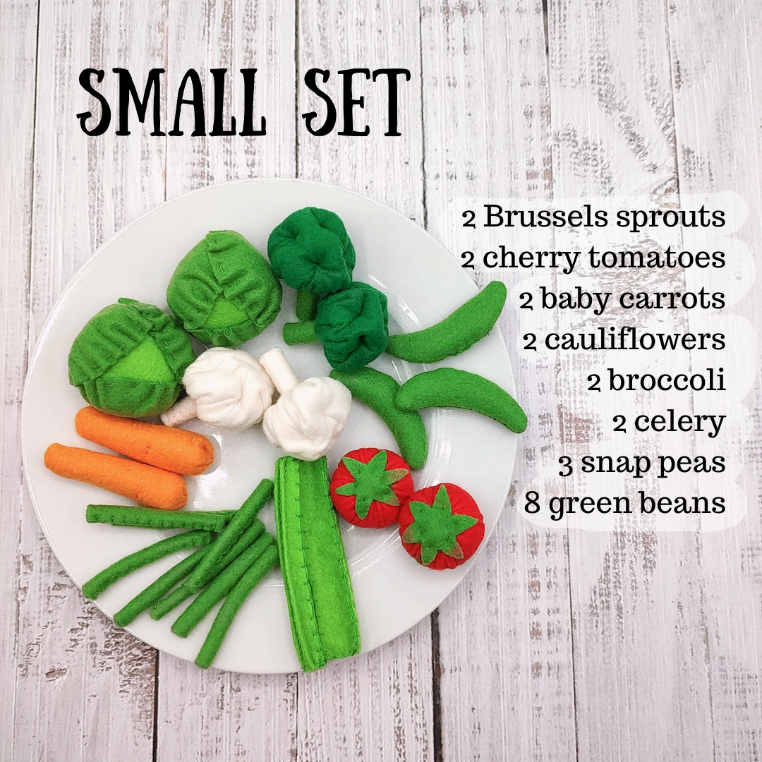 Set of felt vegetables on a white plate with text indicating types and quantities.