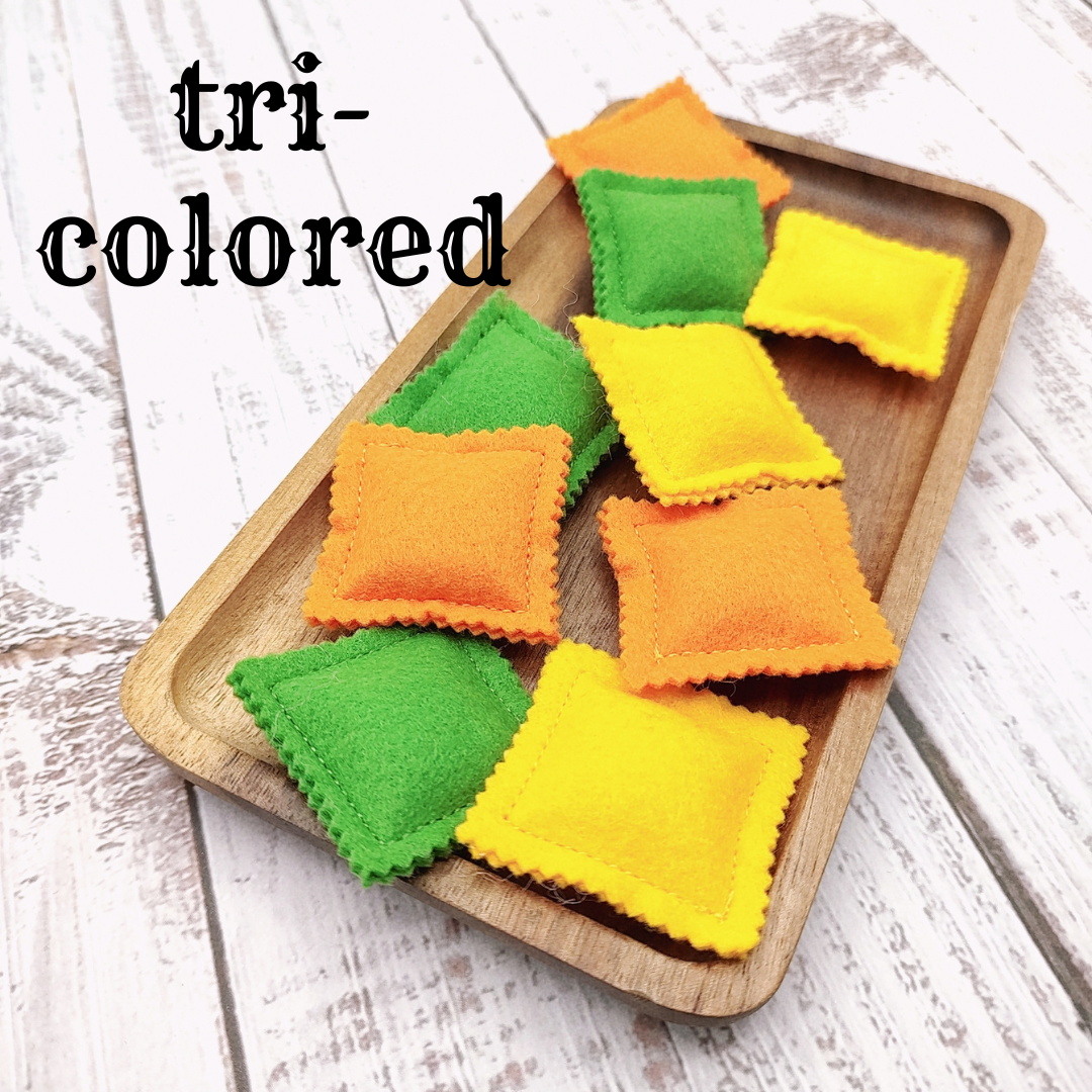 Ravioli pasta colored farfalle, bow tie play food