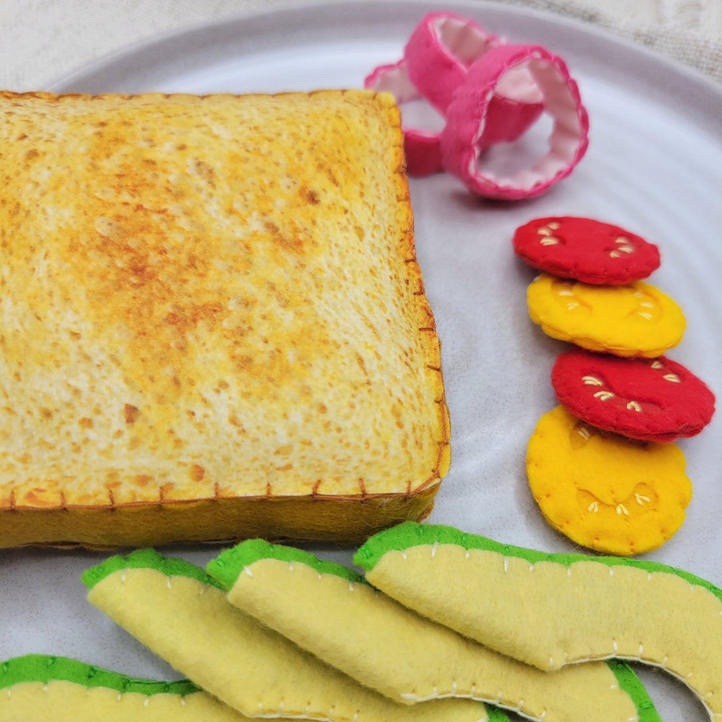Close-up avocado toast plush sandwich pretend food
