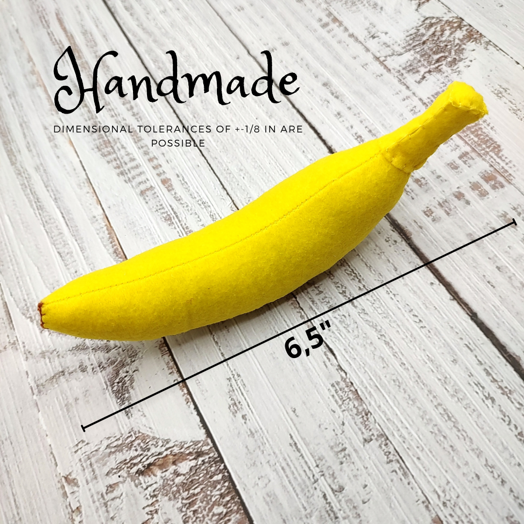 Yellow plush banana toy on a wooden surface with 'Handmade' text and dimensions.