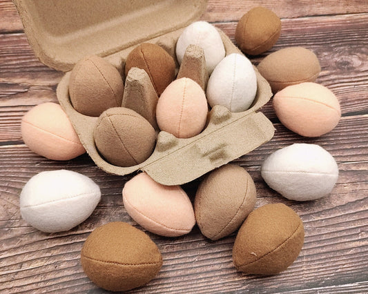 Egg plush toy felt play food on wooden background
