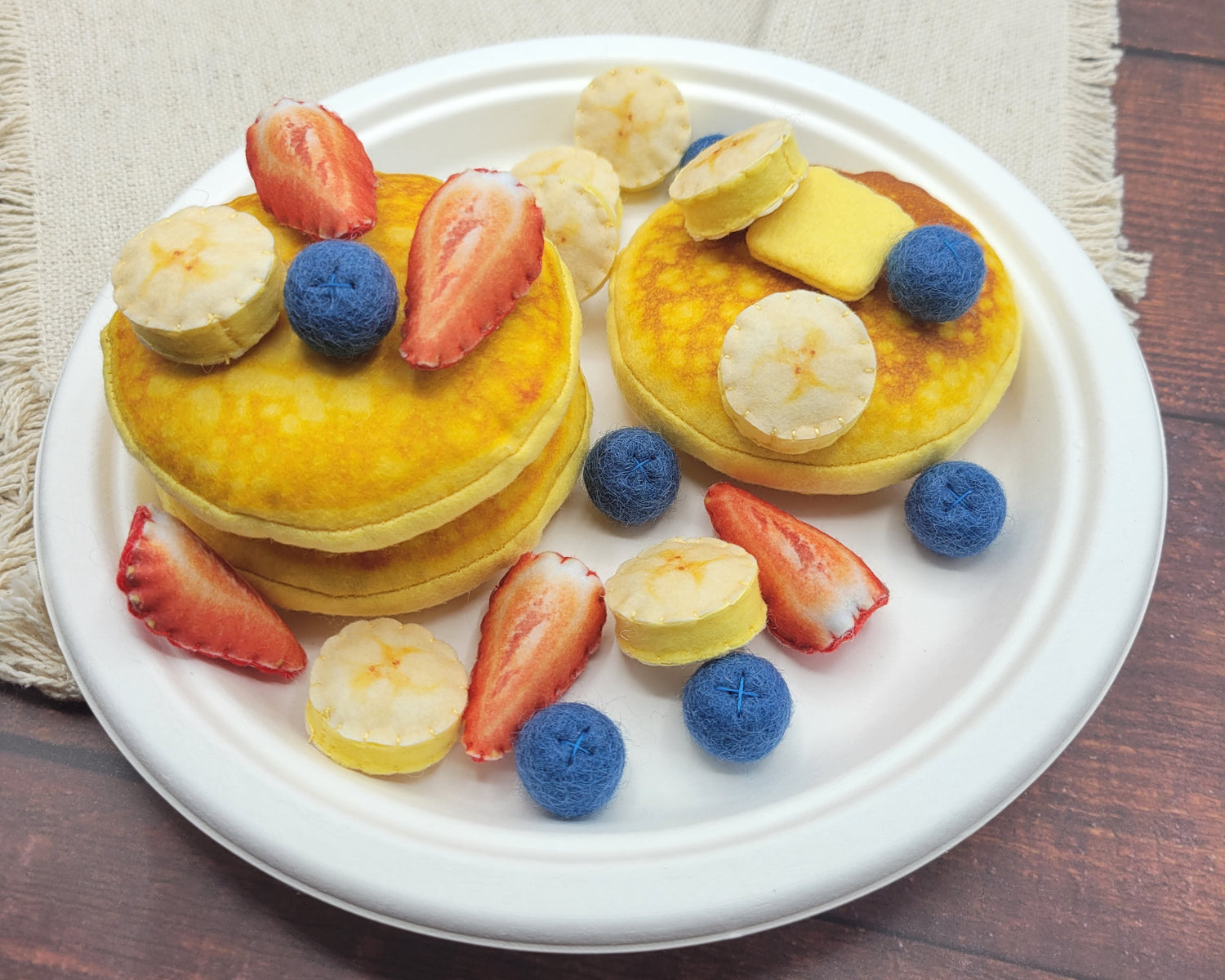 Pancake plush toy felt play food on white background