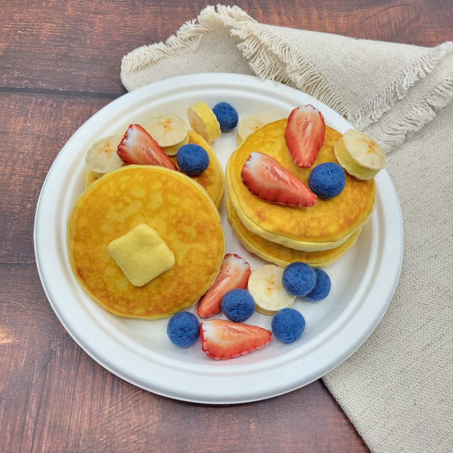Plush pancake toy served on toy plate for kids pretend cooking