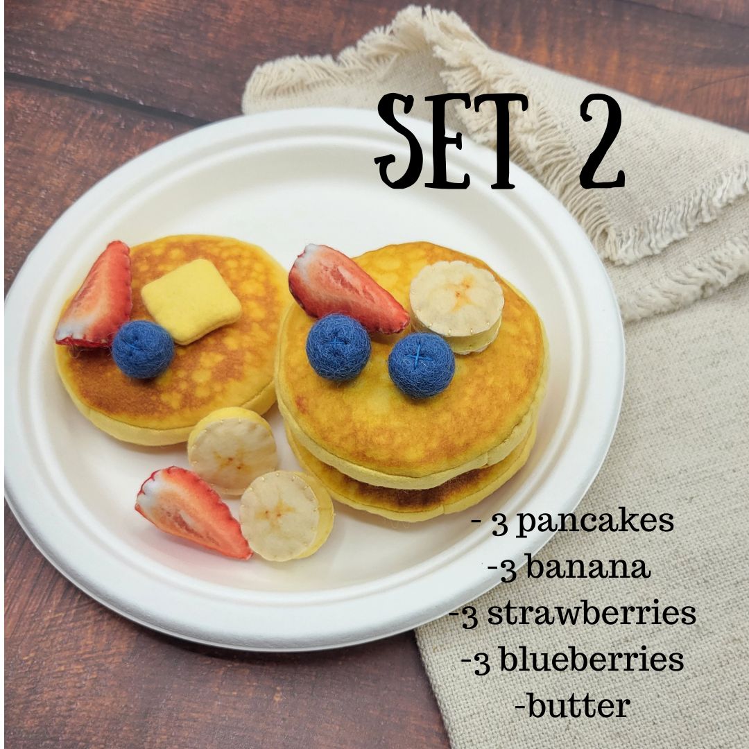 Set of pretend play plush pancakes with fruit on a plate, labeled 'Set 2'.