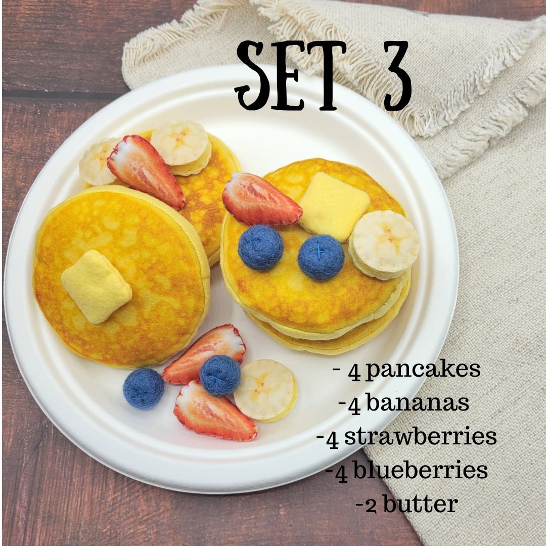 Pancake plush toy flat lay with other play food items