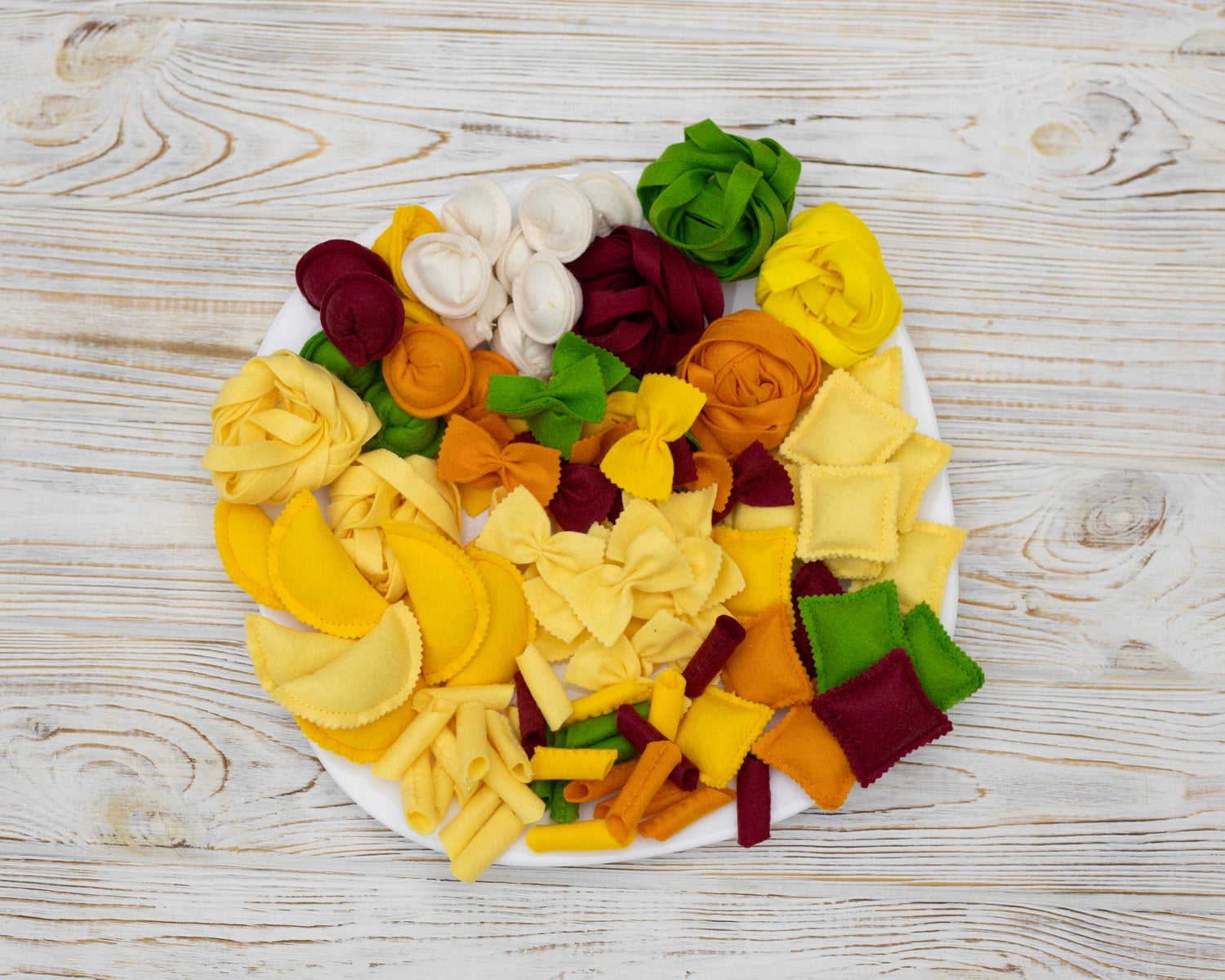Pasta set plush toy felt play food on white background