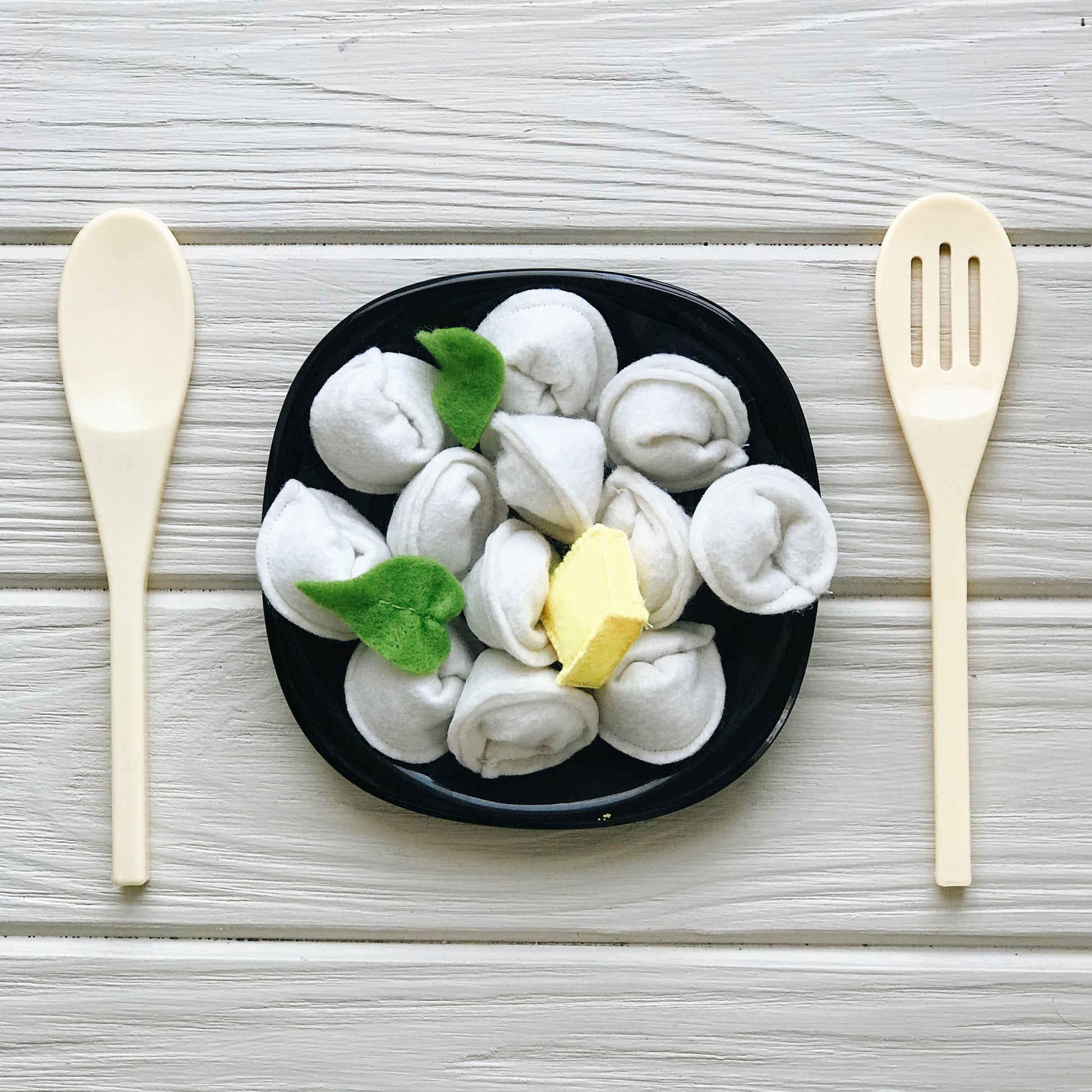 Close-up of felt tortellini, ravioli, farfalle details