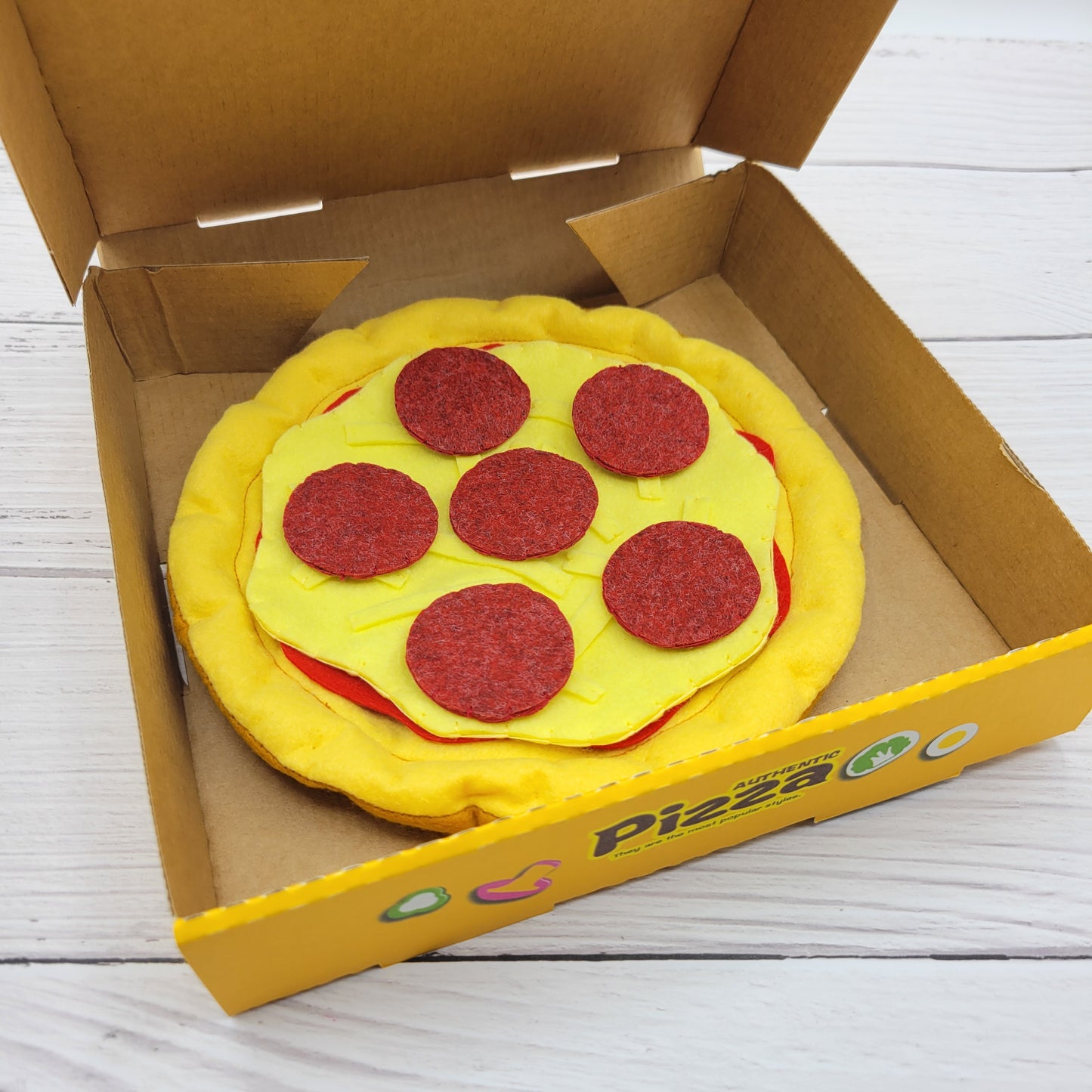 Plush pizza set in pretend restaurant setup