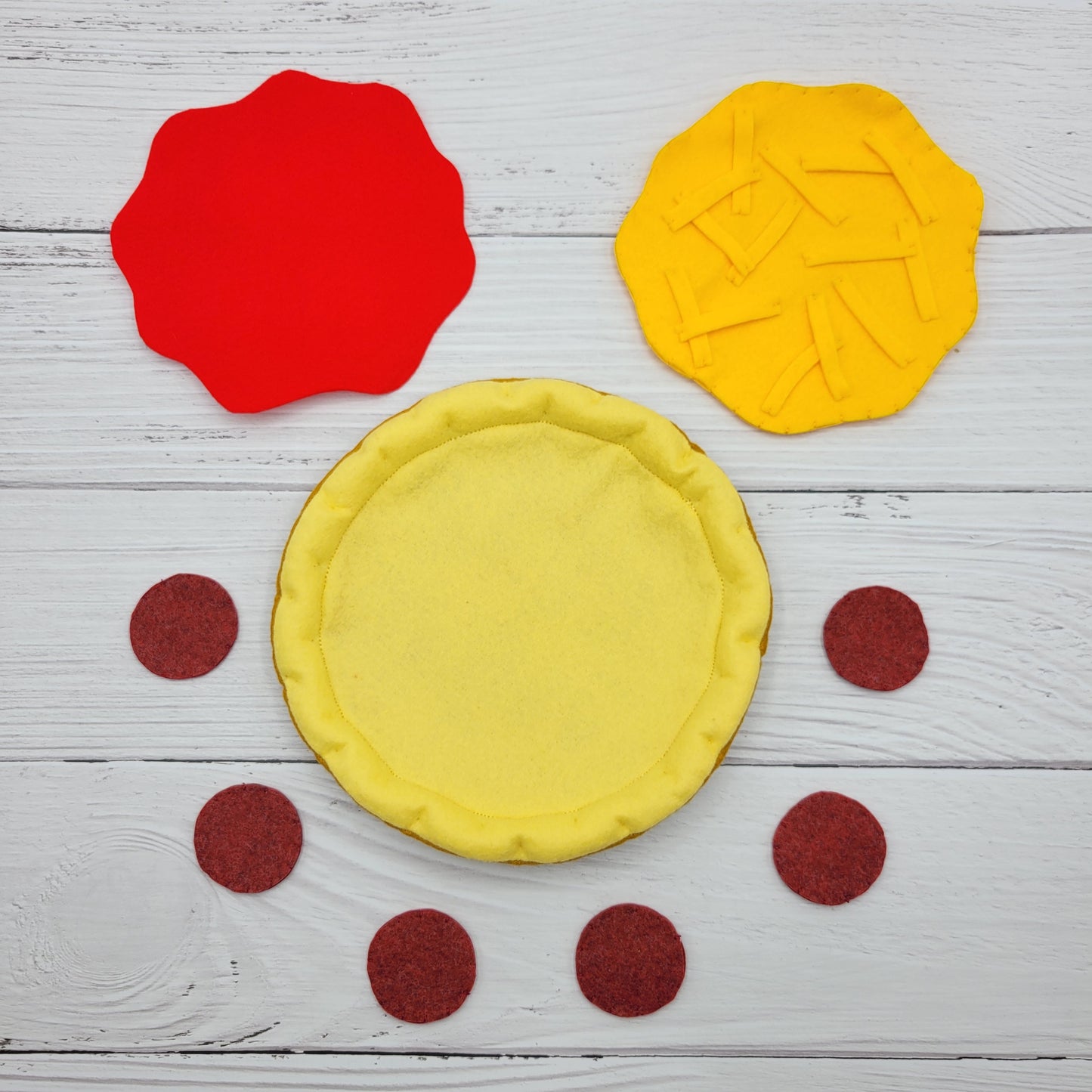 Close-up of felt texture and toppings on plush pizza