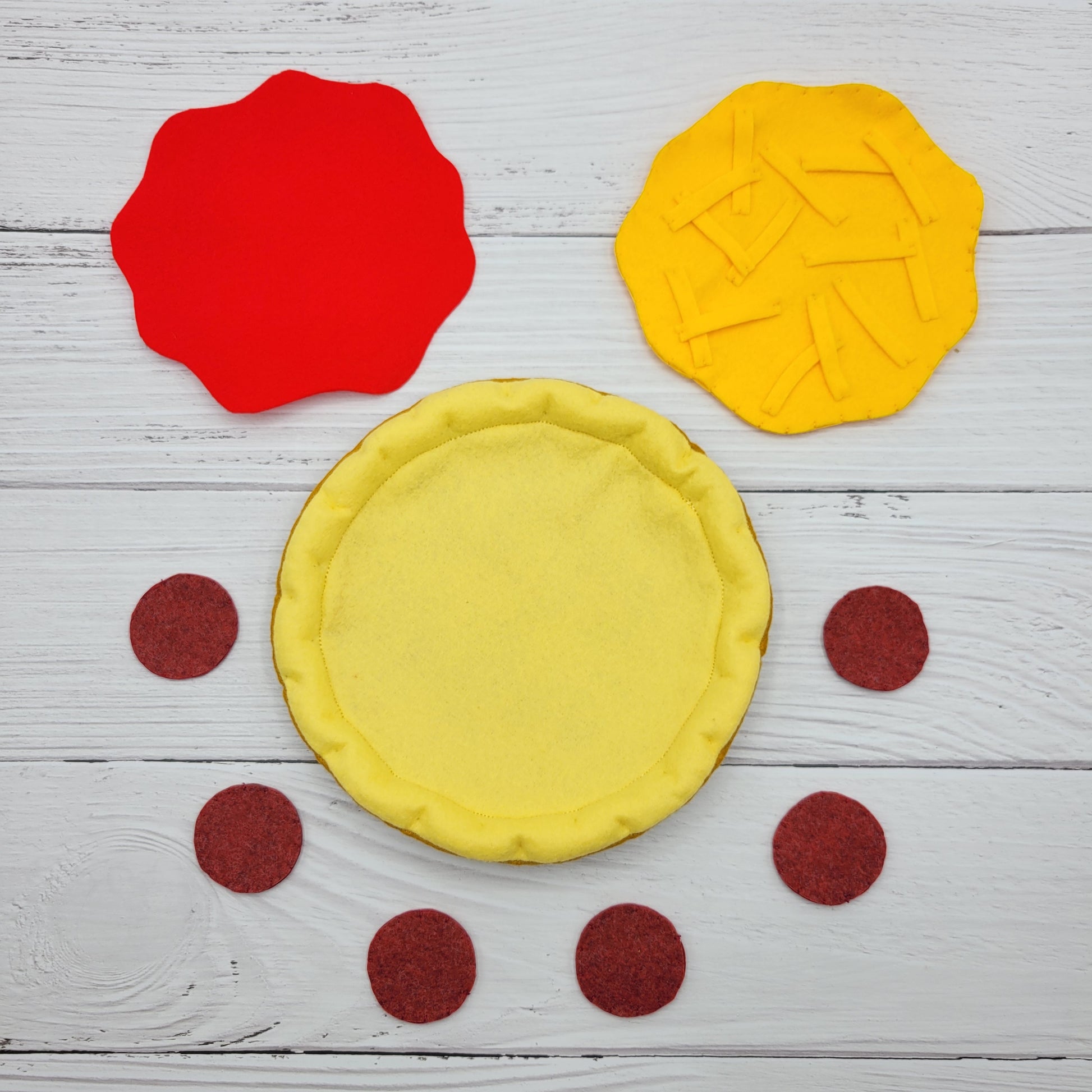 Close-up of felt texture and toppings on plush pizza
