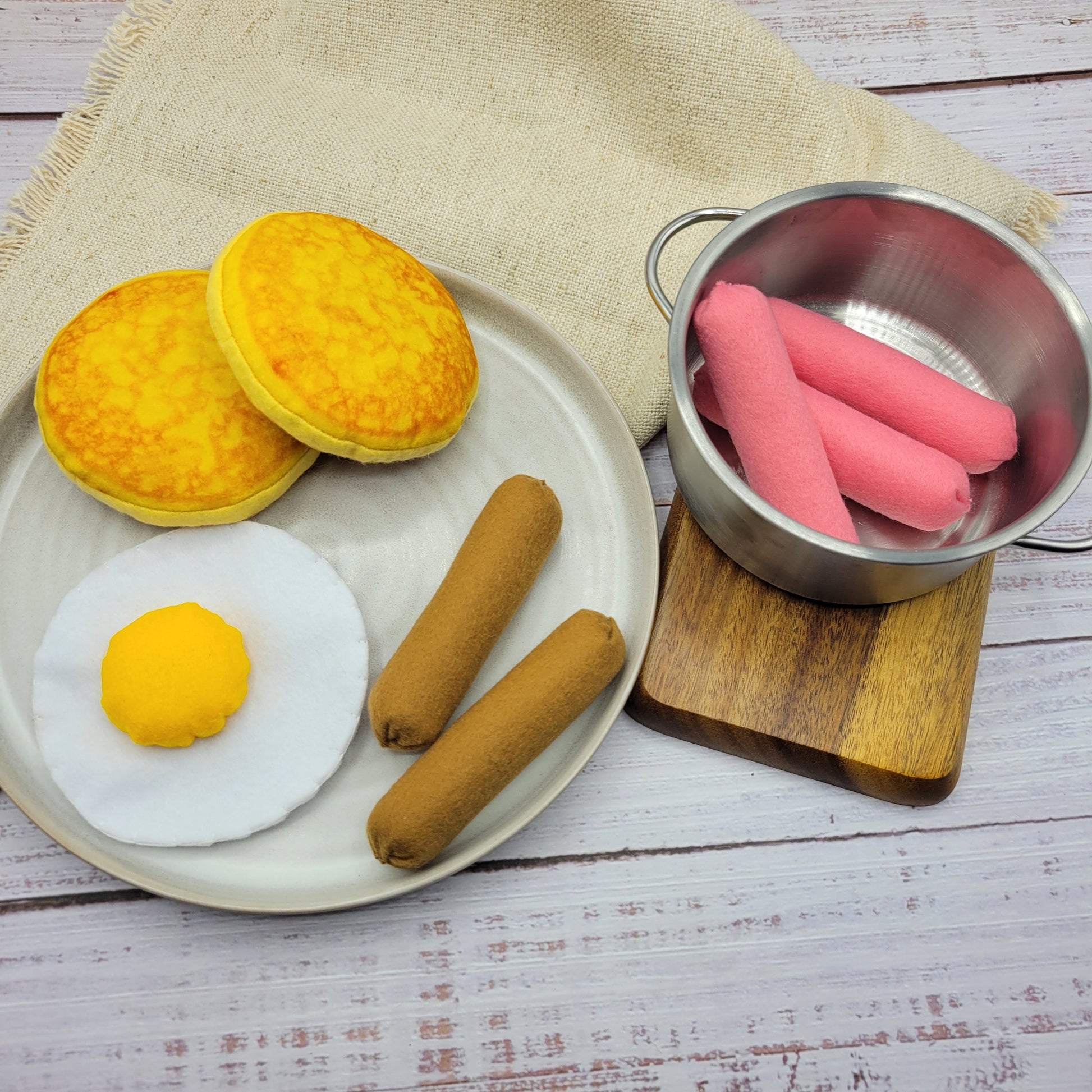Close-up sausage plush toy pretend food felt accessory with breakfast