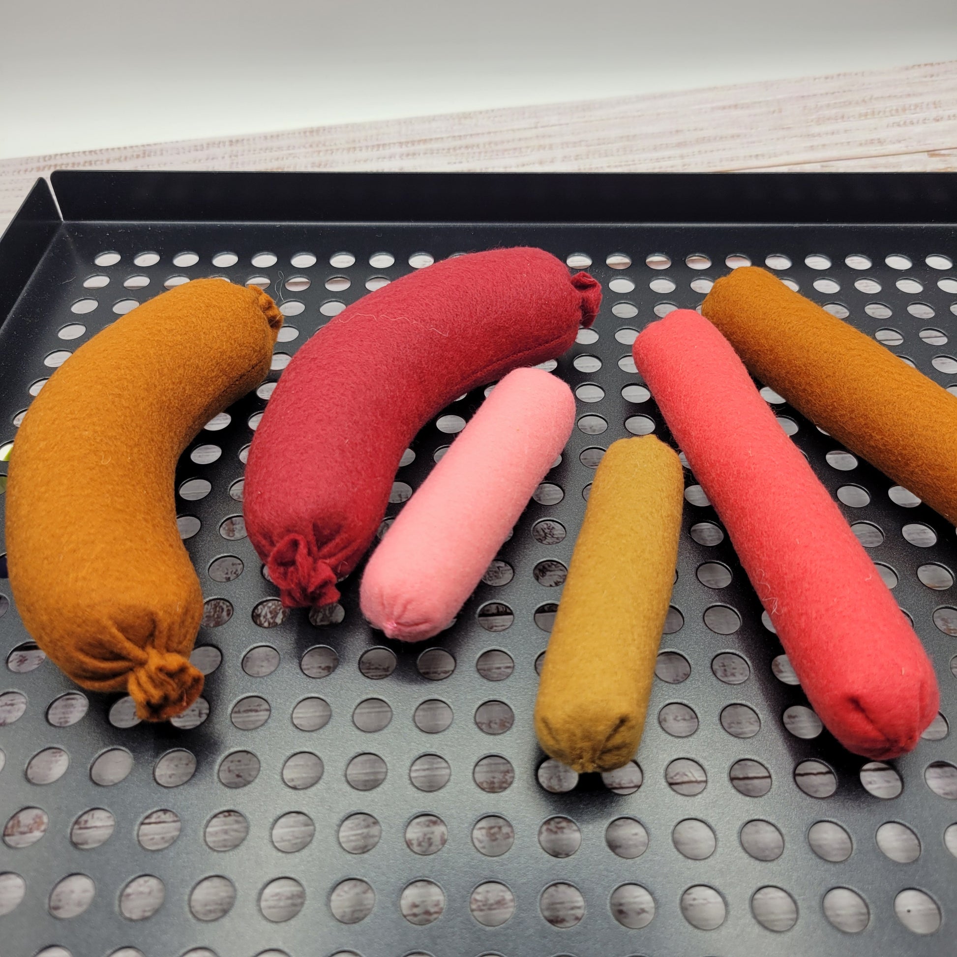 Sausage plush toy with other felt play food pieces