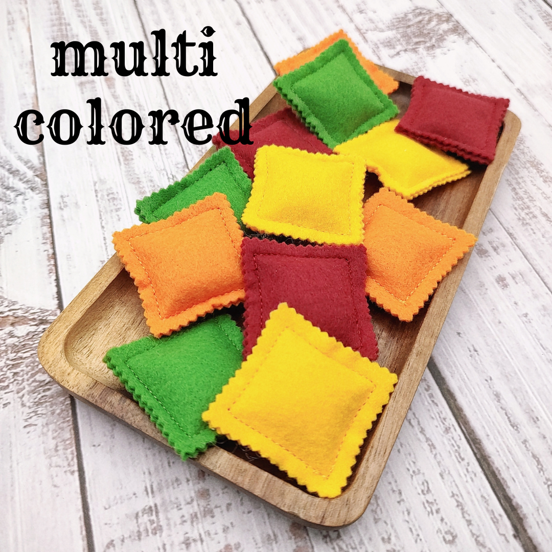 Ravioli pasta colored farfalle, bow tie play food