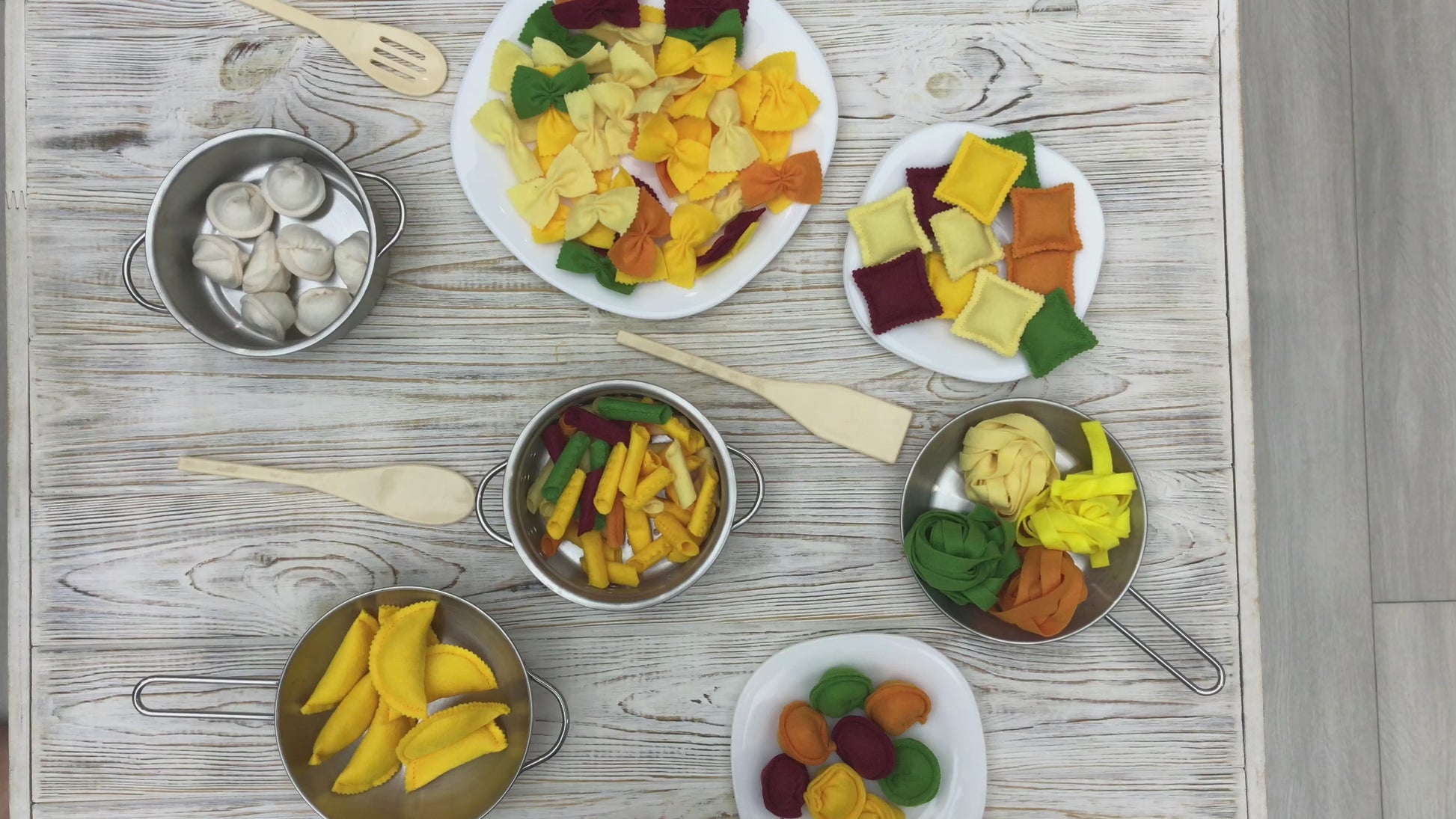 Plush pasta set displayed on toy plate for pretend play