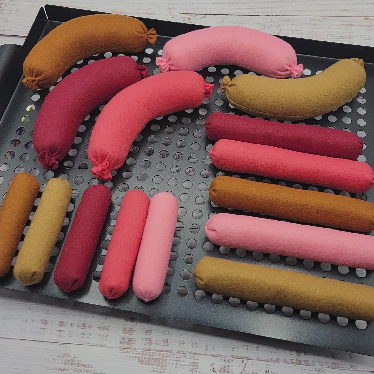 Close-up sausage plush toy pretend food felt accessor on video