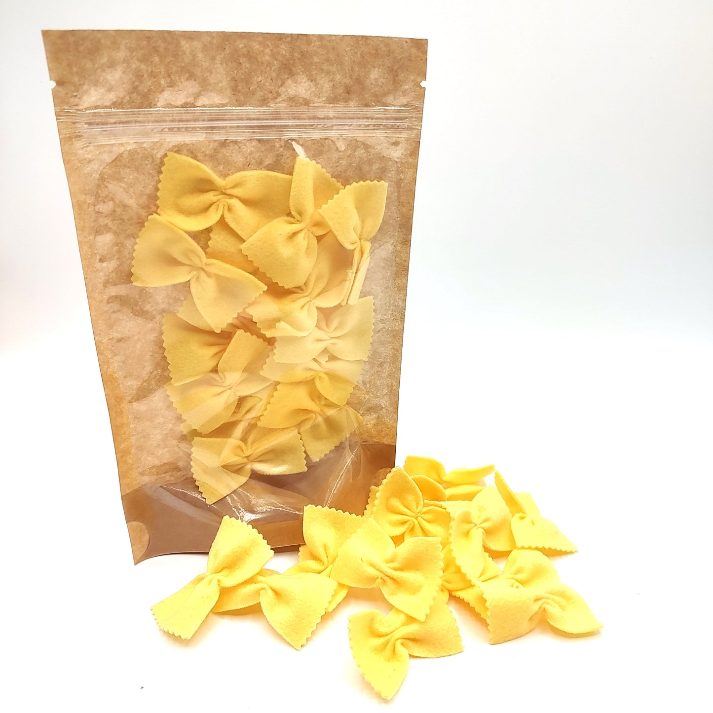 Pasta beige farfalle, bow tie play food