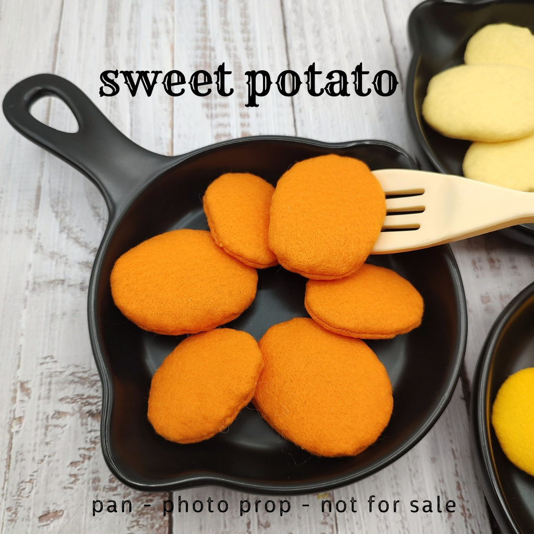 Baked slice potatoes, roasted sweet potato play food